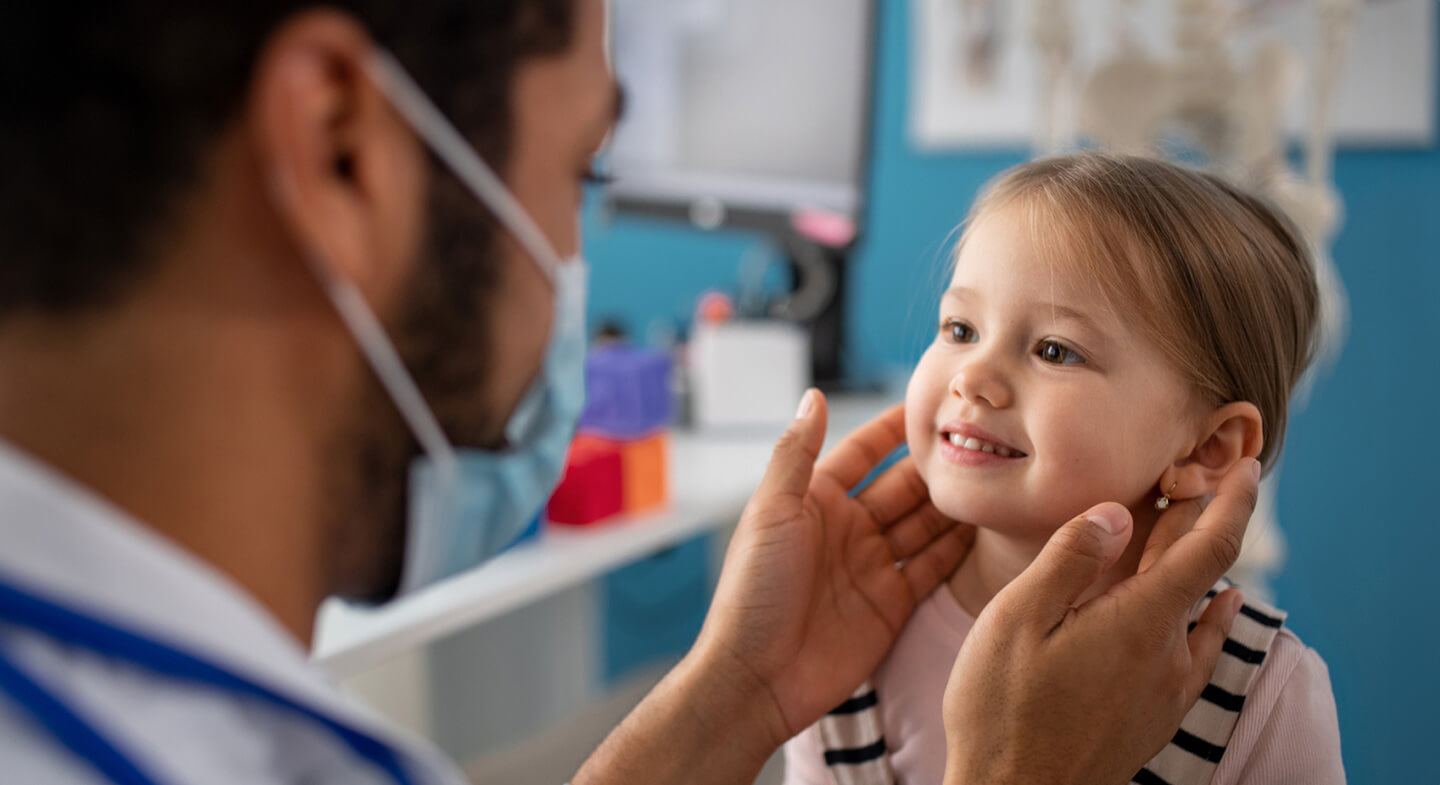 physician examining child